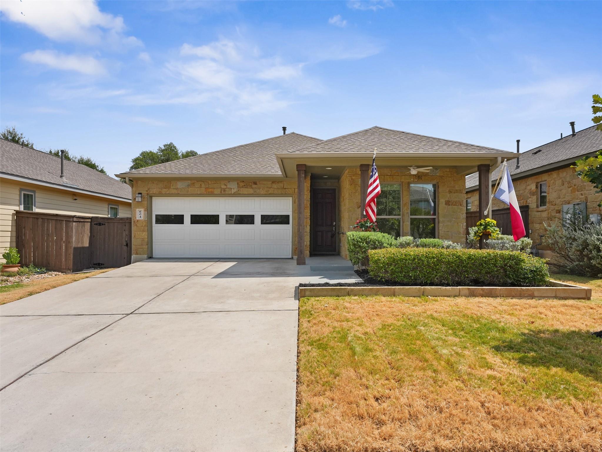 Stone accents and a covered front porch create wa