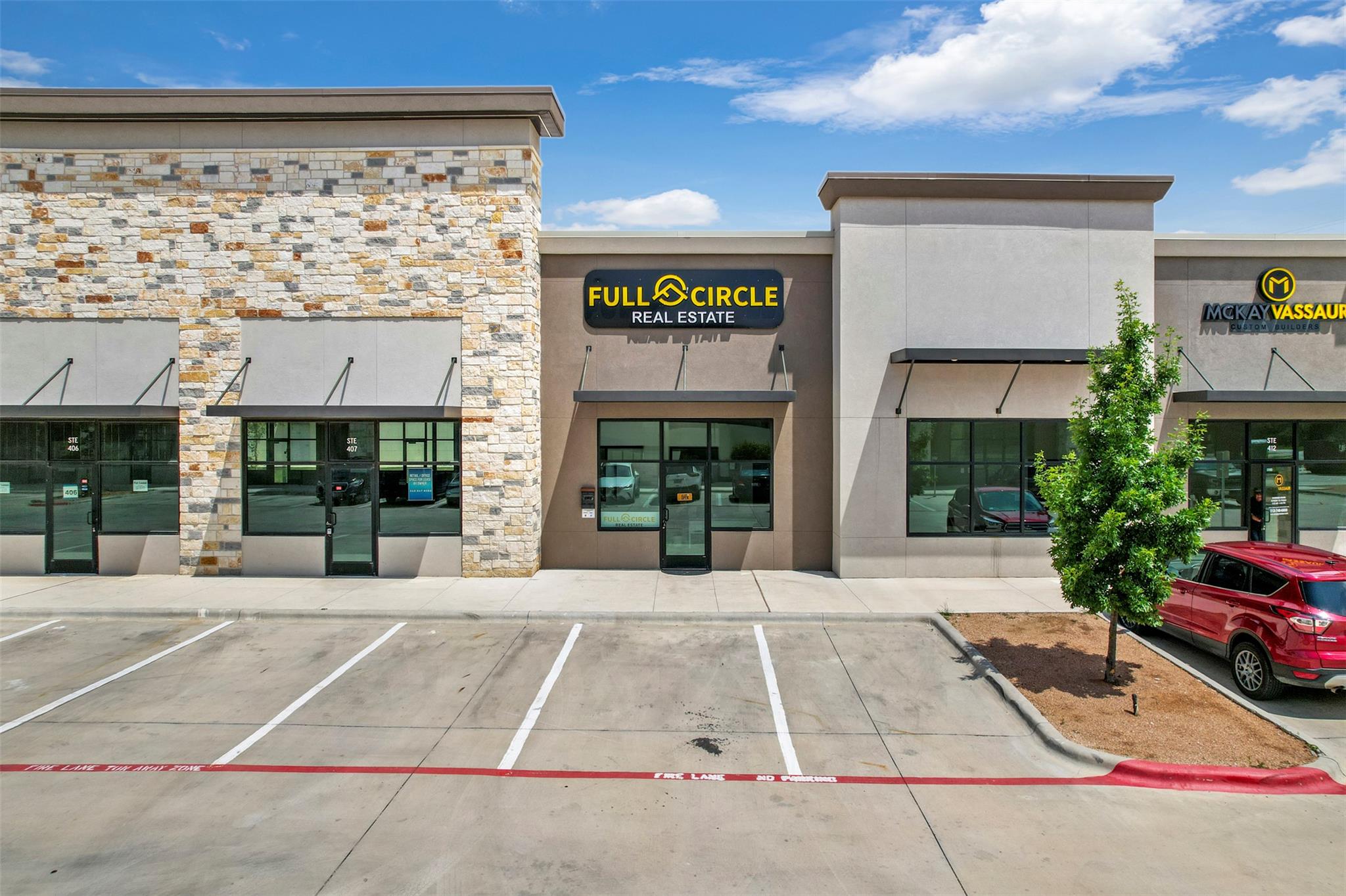 A commercial complex features modern stone and st