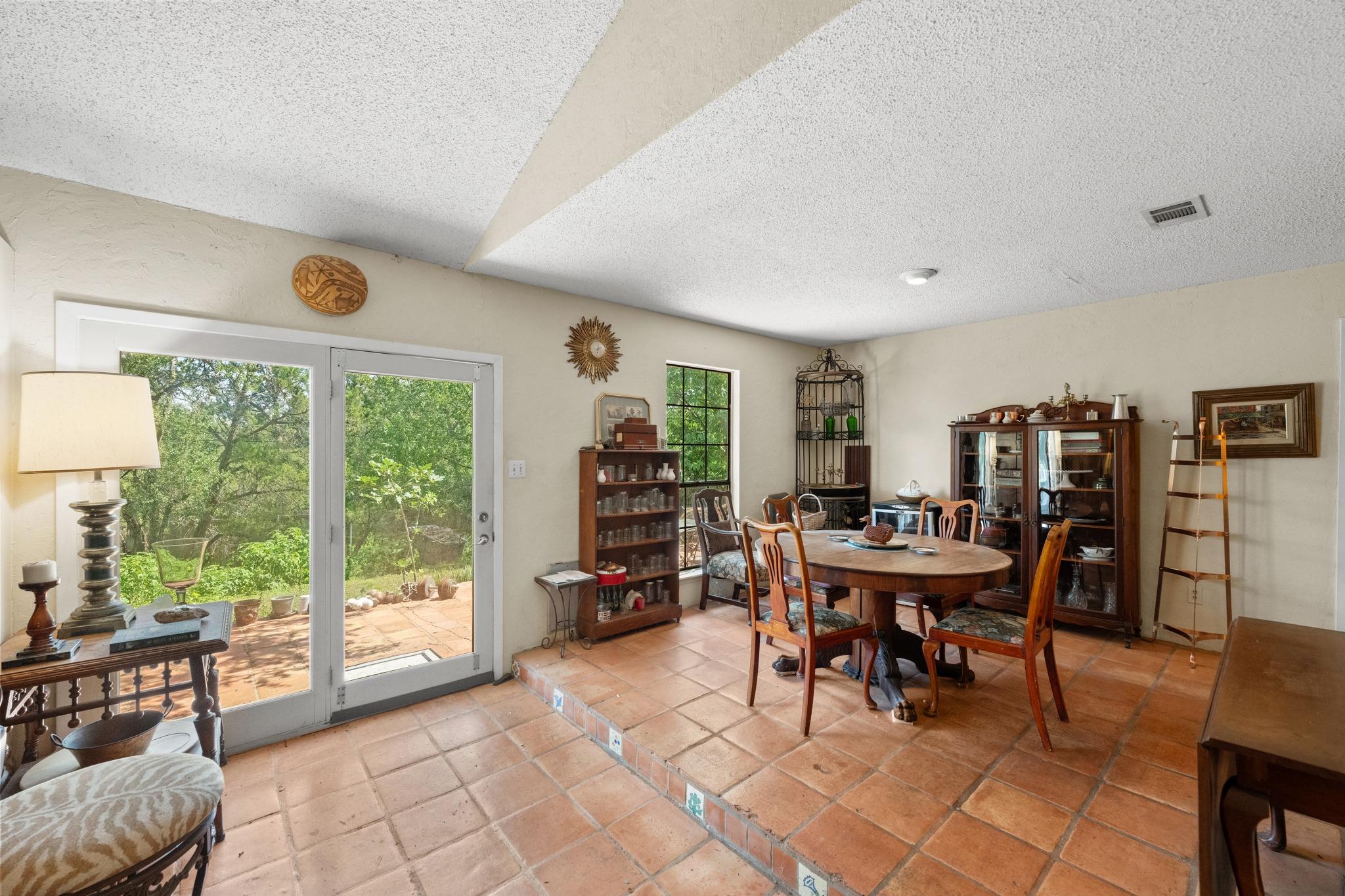 Natural light floods this dining area, featuring 