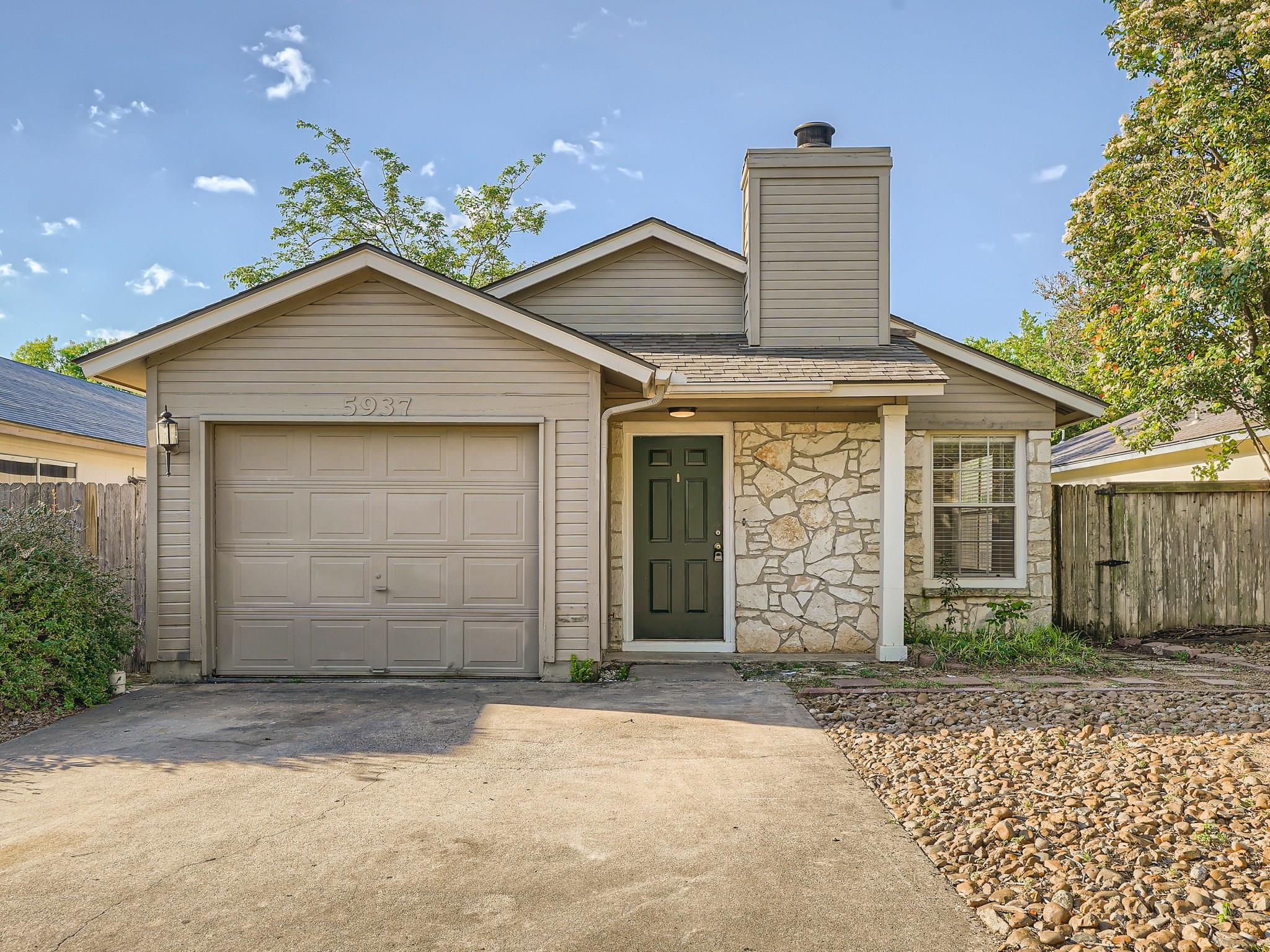 A welcoming facade features a single-car garage a
