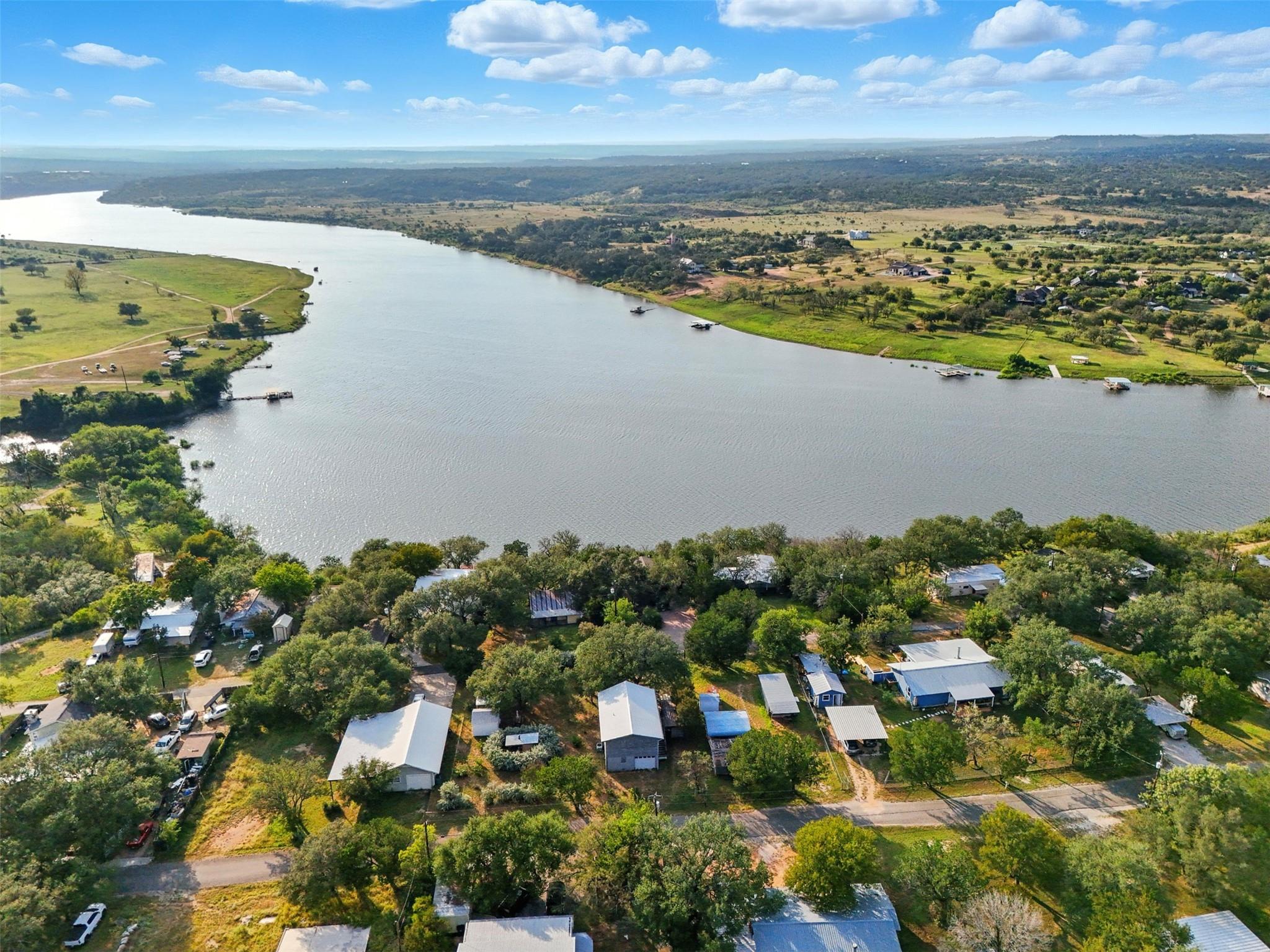 An aerial panorama reveals a waterfront community
