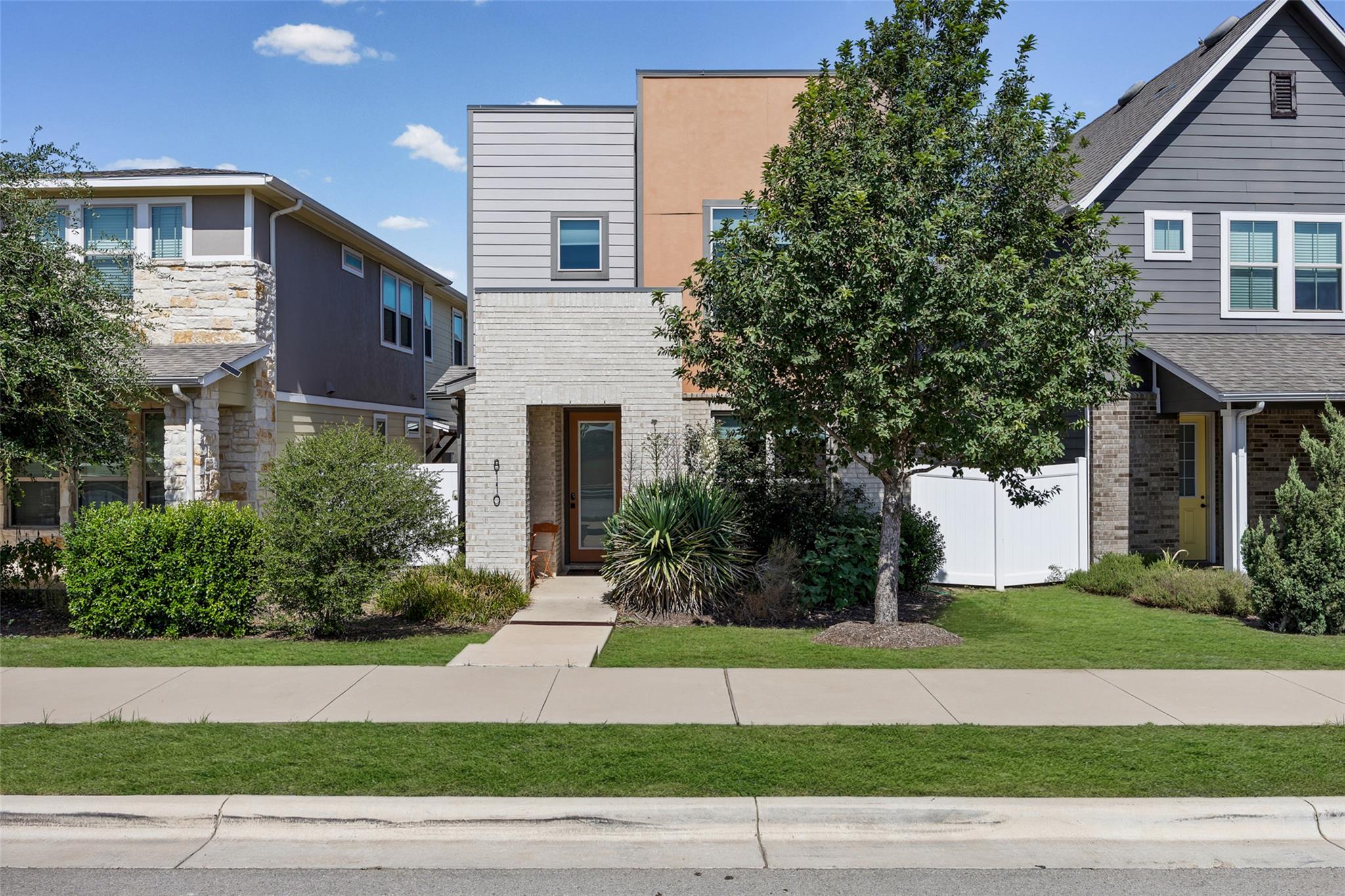 Modern mixed-material elevation features a clean 