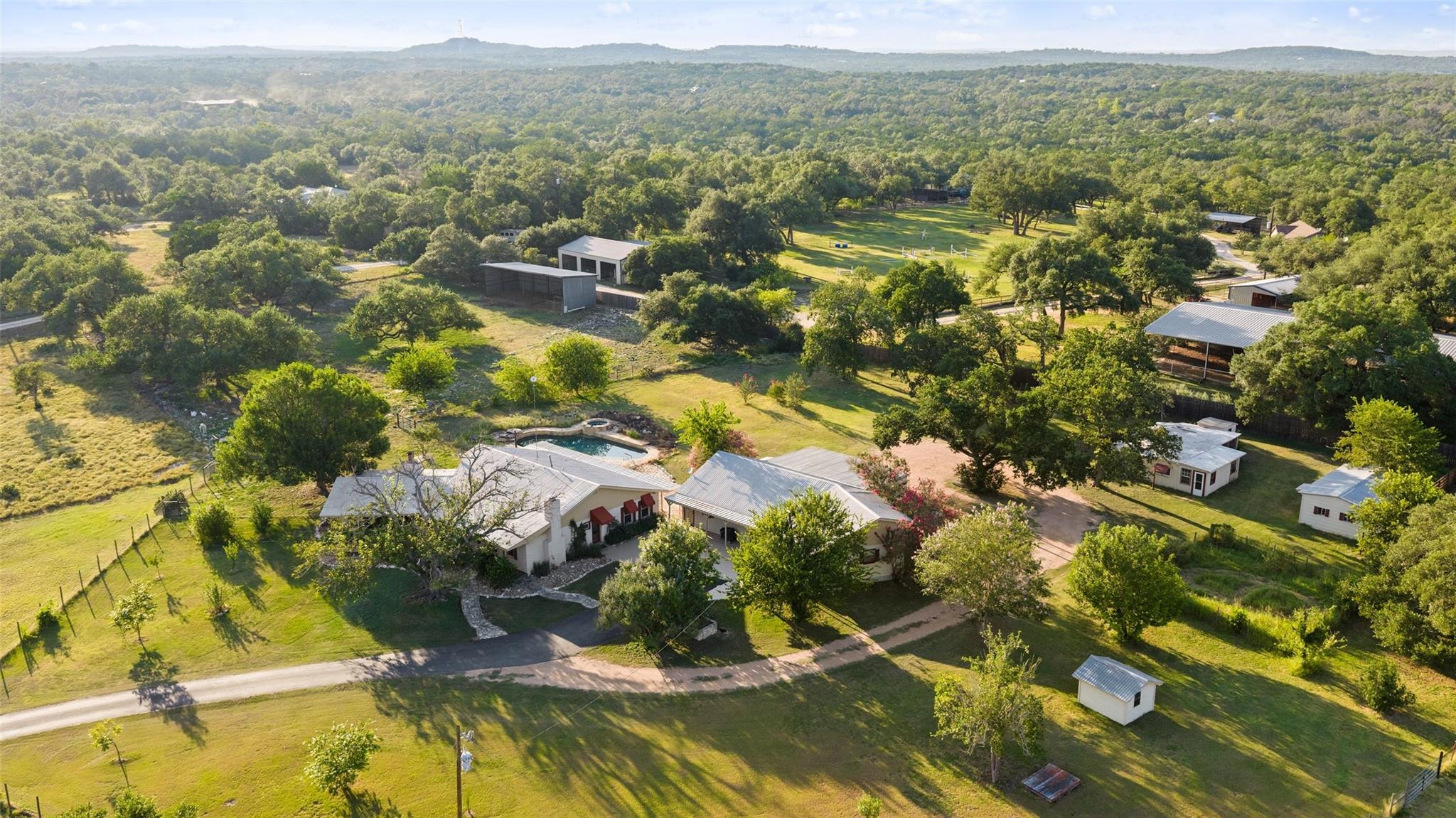 An aerial panorama reveals a sprawling estate nes