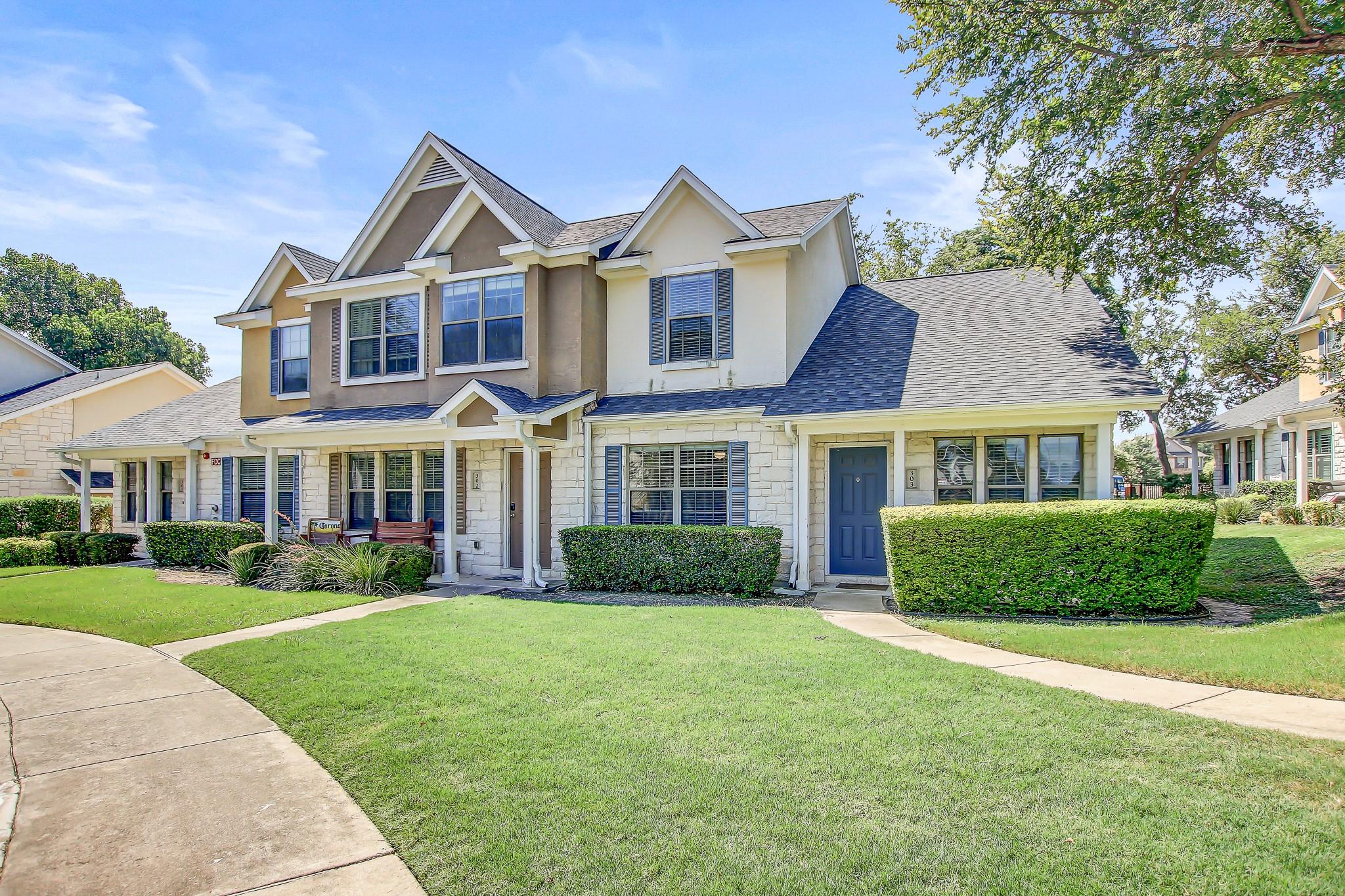 A classic two-story facade with stone accents and