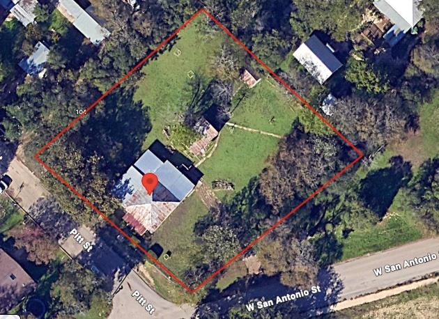An aerial view showcases a residential lot with m