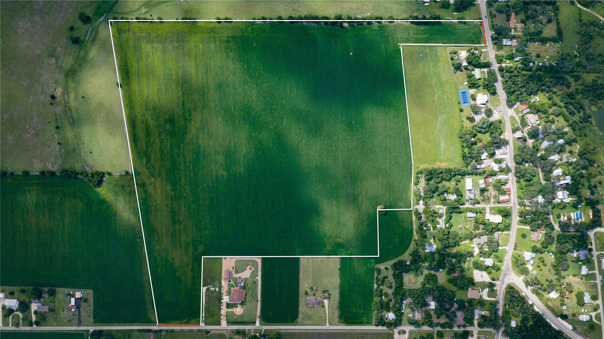 A sweeping aerial view showcases a verdant agricu