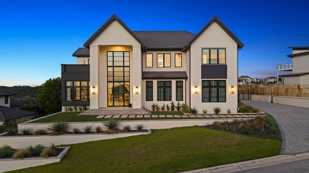 A grand entrance with expansive windows and metic