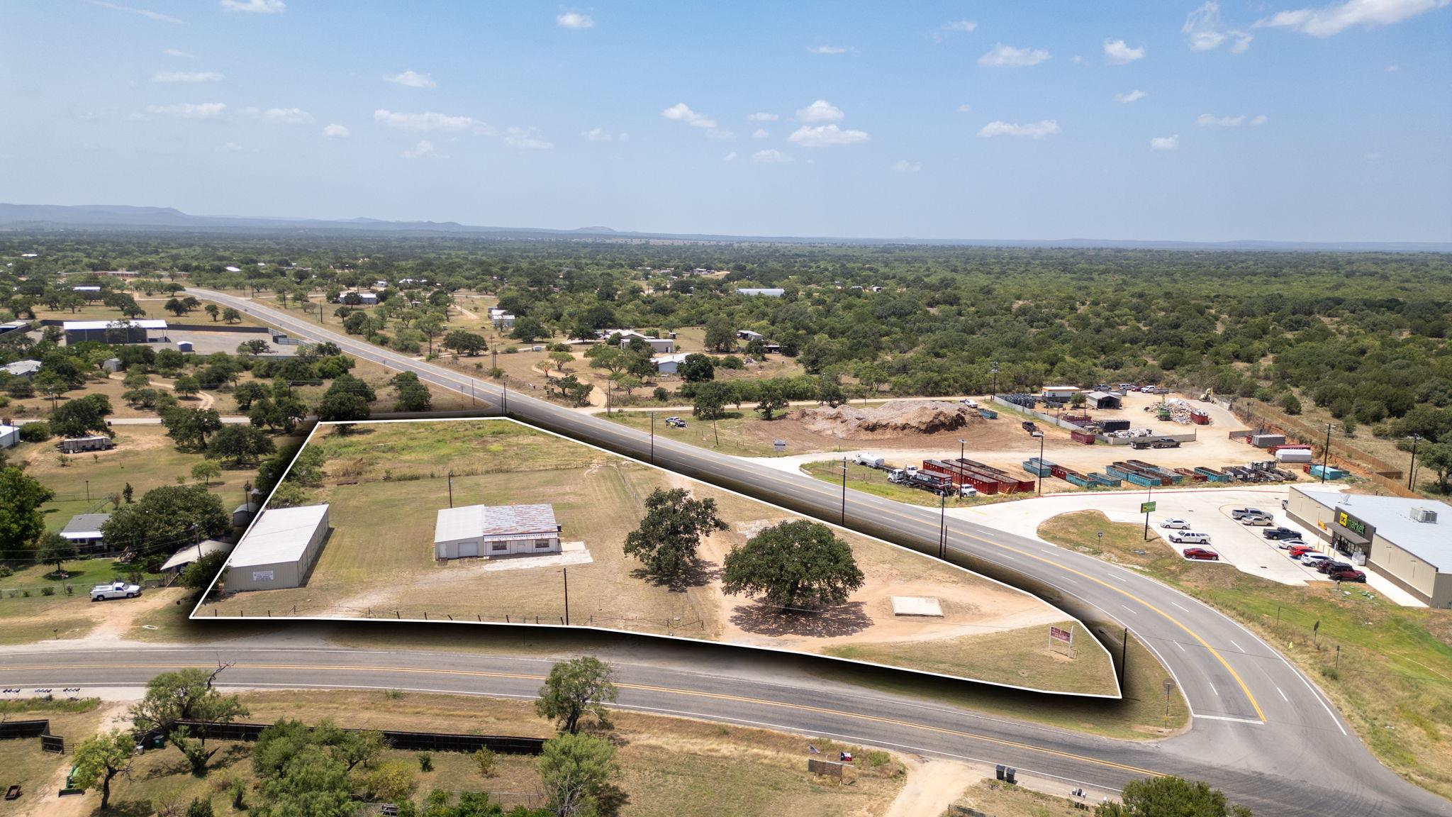 Panoramic aerial view showcases a spacious lot wi