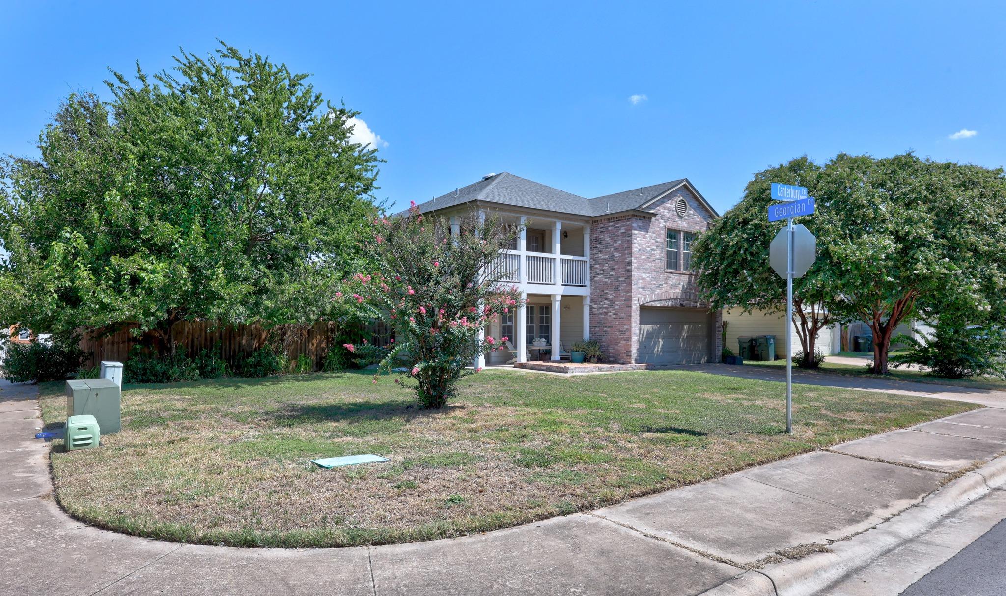 A classic brick exterior graces this appealing tw