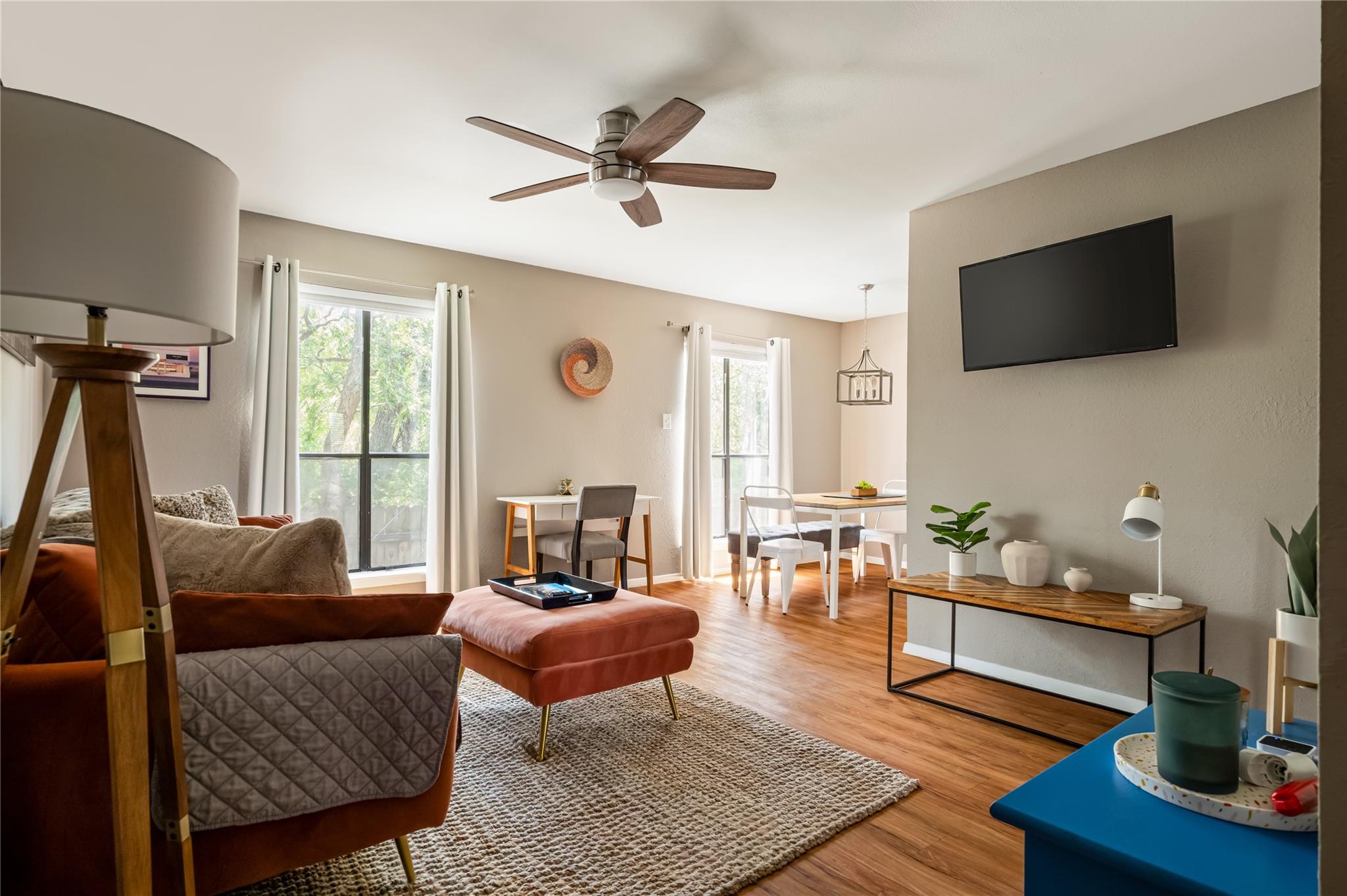 A well-lit open floorplan connects the living are