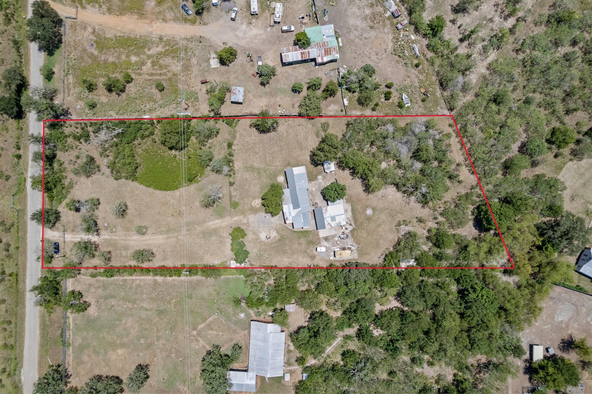 An aerial view showcases a vast property with a m