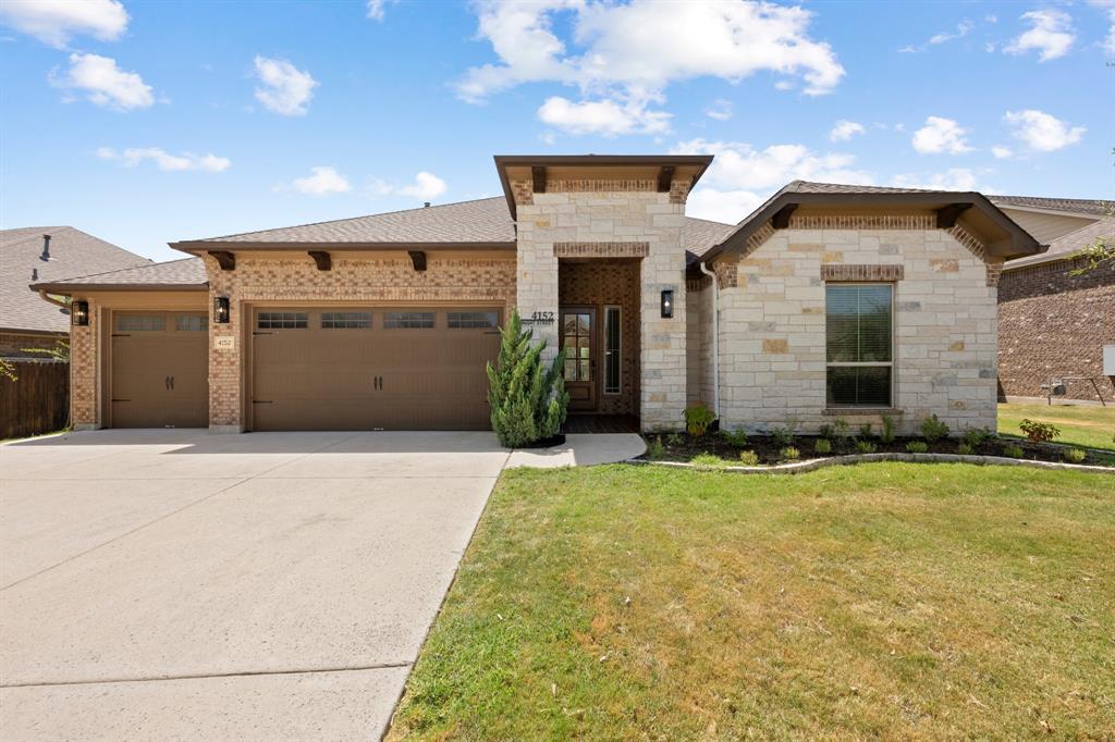 Limestone accents and architectural gables define