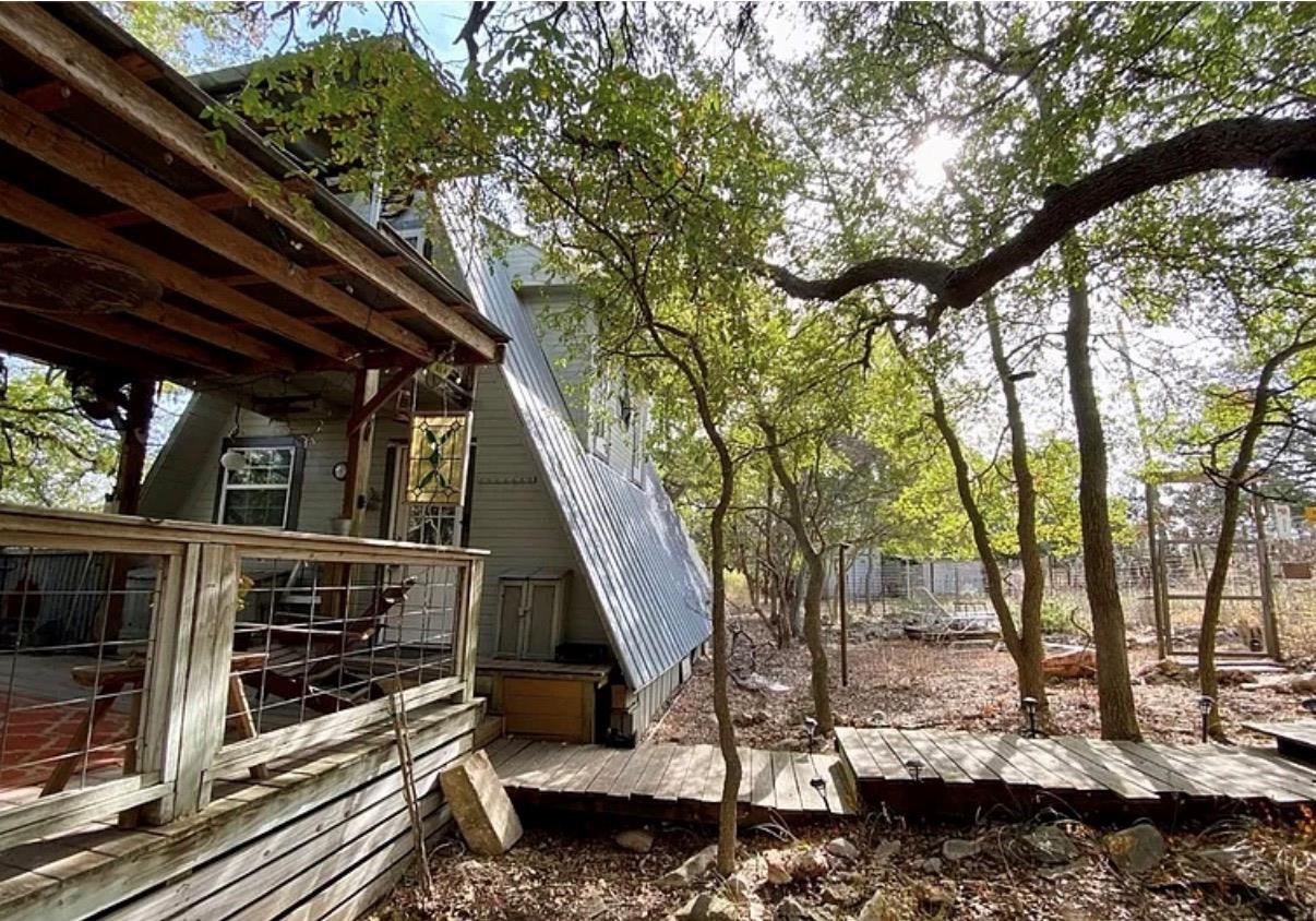 A-frame retreat featuring a charming porch and a 
