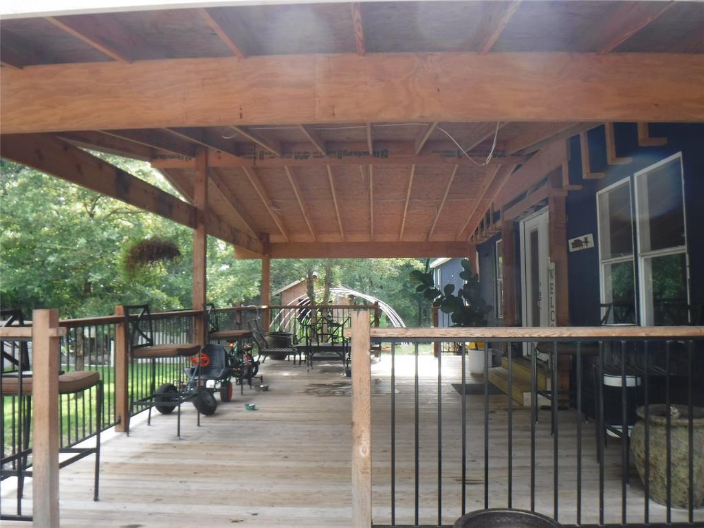 An inviting covered porch extends a warm welcome,