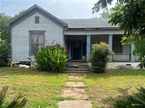 A charming cottage facade, complete with a welcom