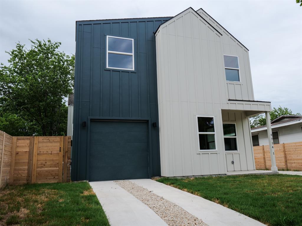 A modern two-story home with contrasting vertical
