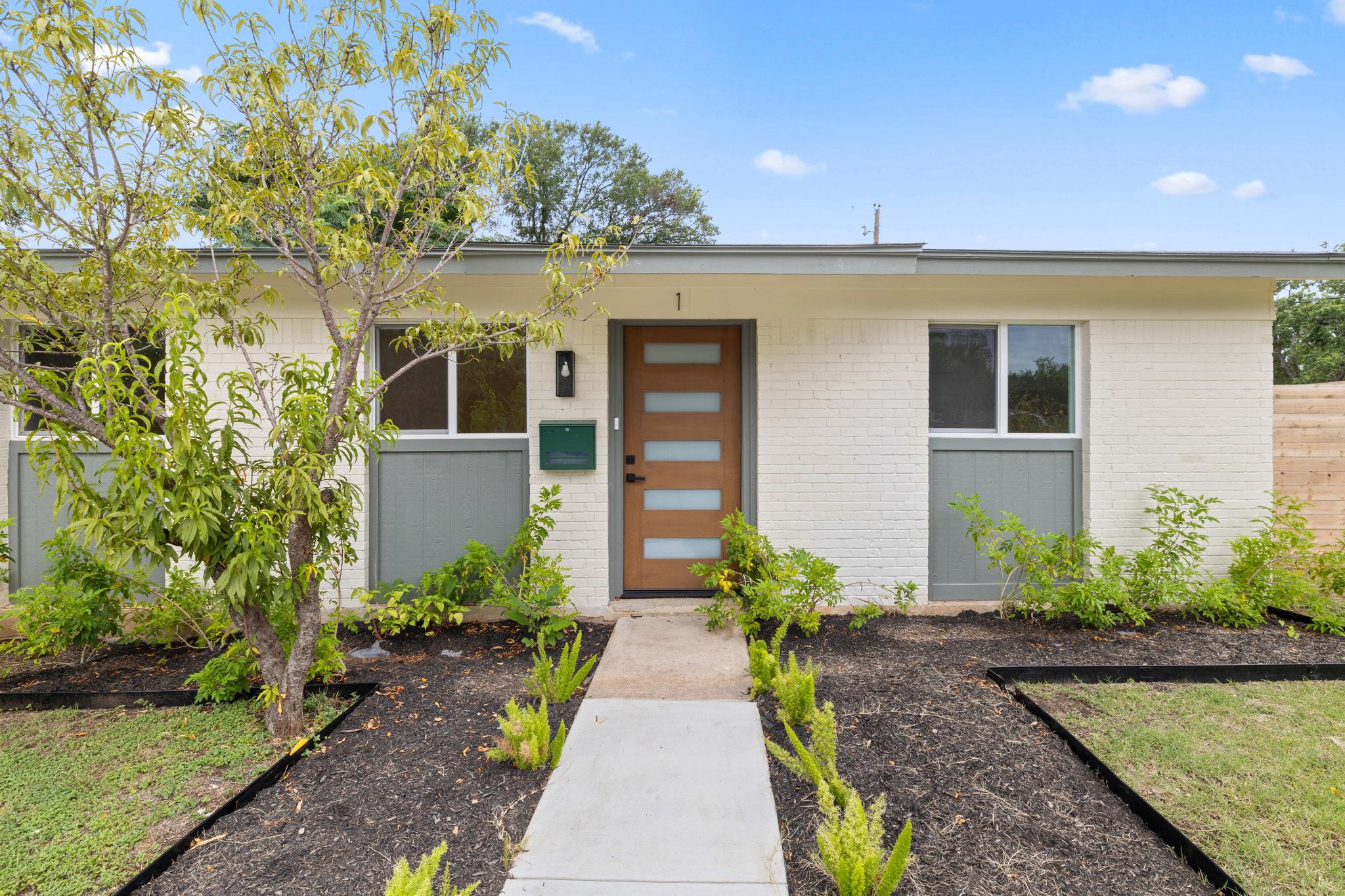 A clean, contemporary facade features a striking 