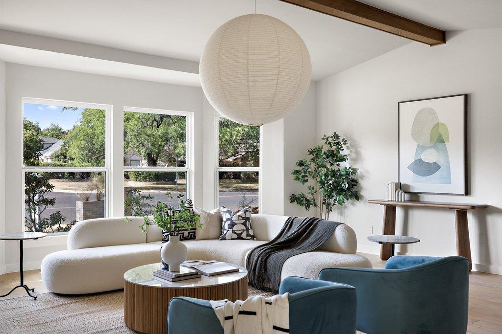 A chic living space featuring a large paper lante