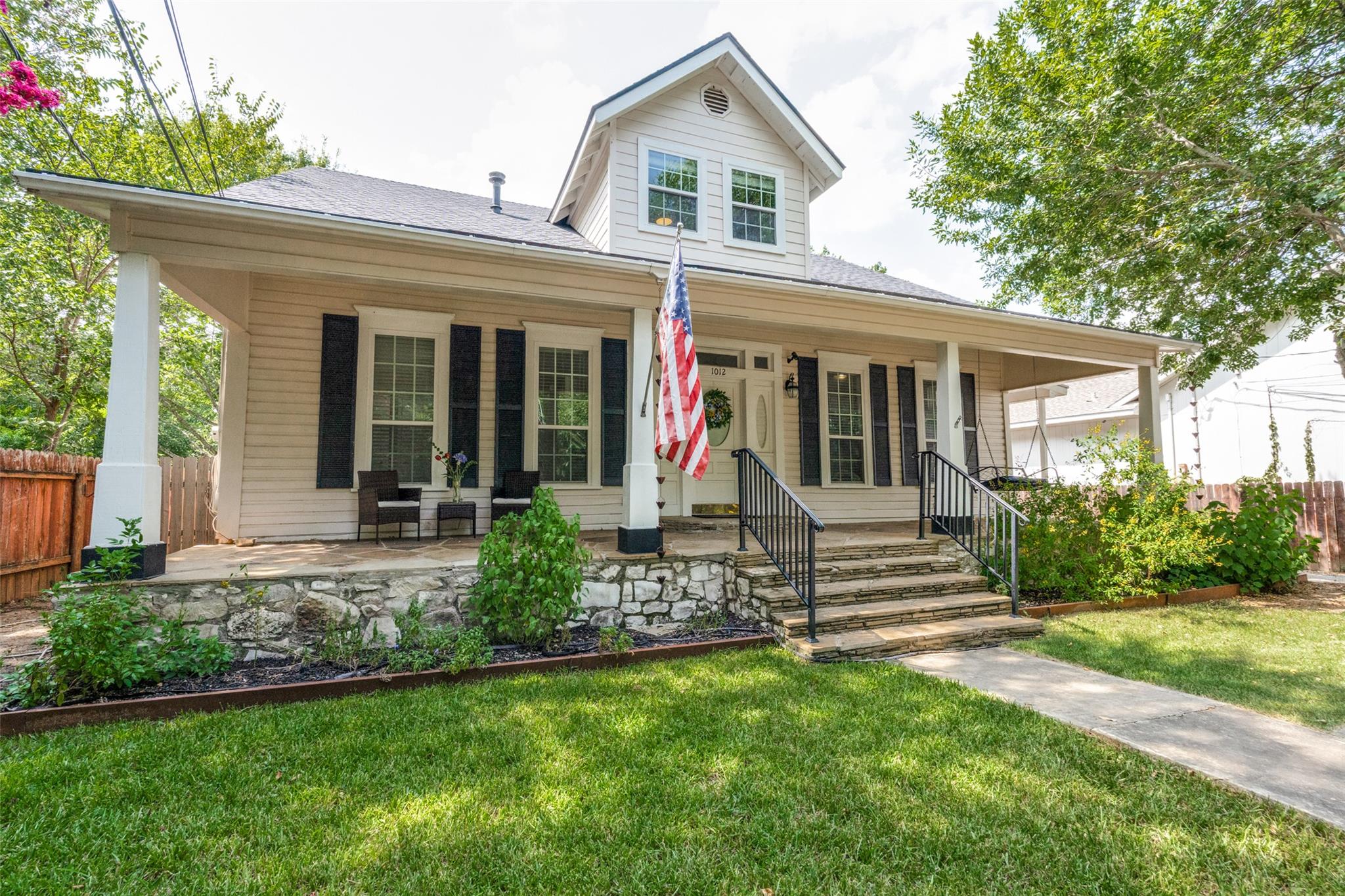 A charming bungalow with a welcoming front porch 