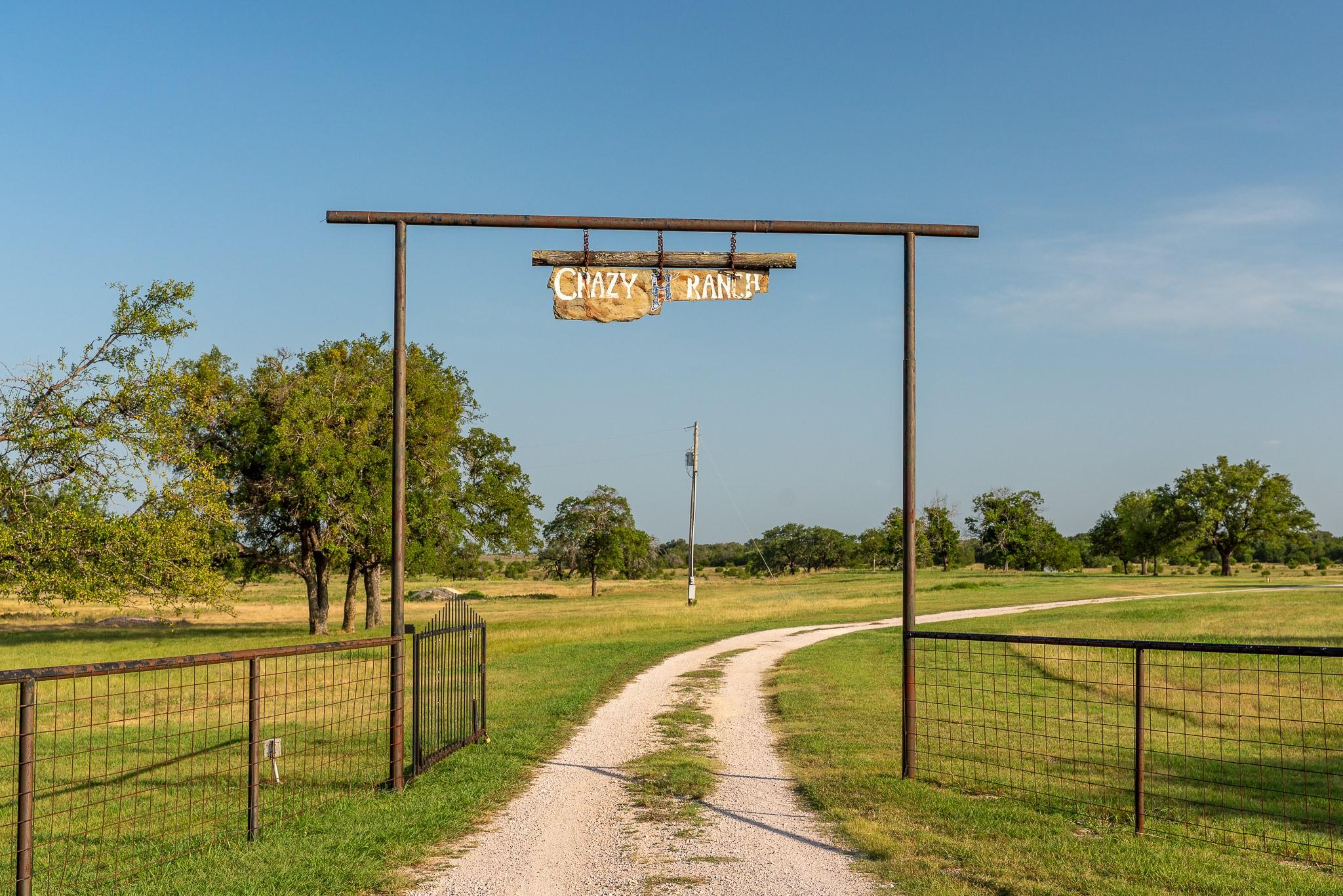 A private driveway welcomes you to expansive acre