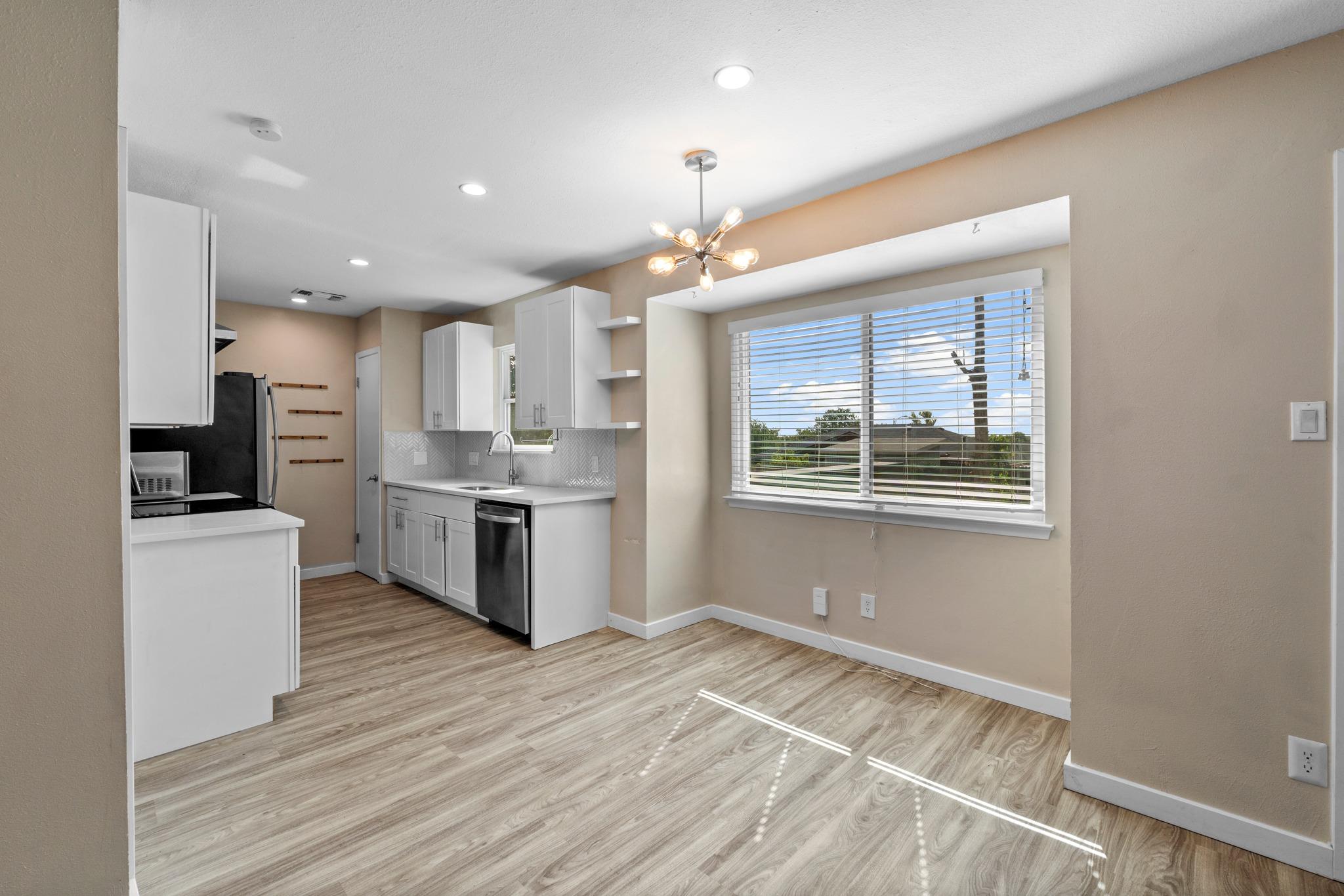 Sun-filled kitchen and dining area with contempor