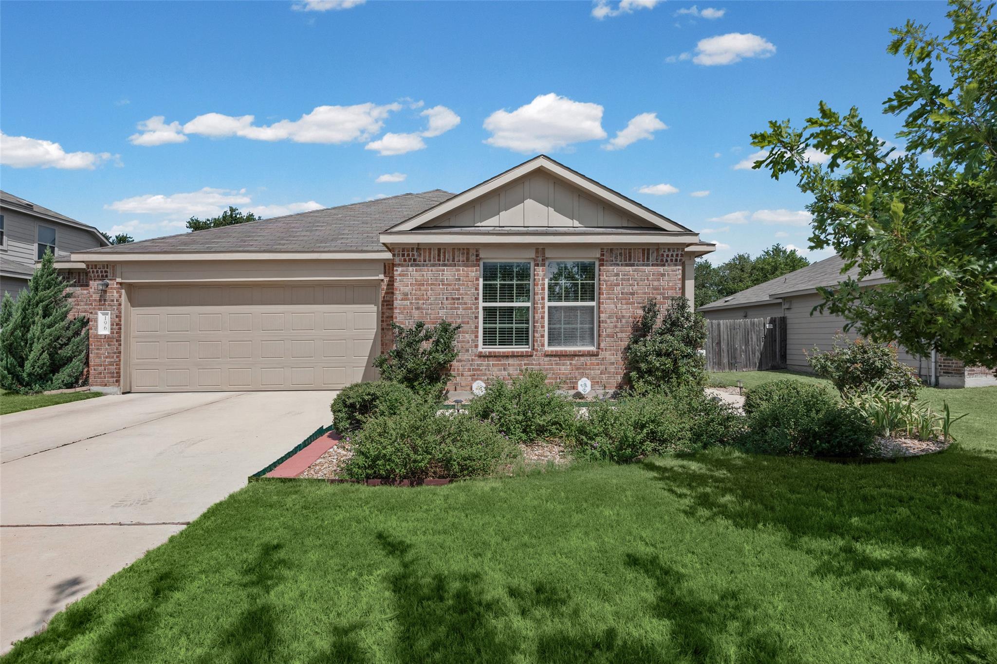 A well-maintained facade with neat landscaping an
