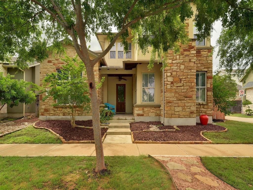 An inviting stone and stucco facade greets guests
