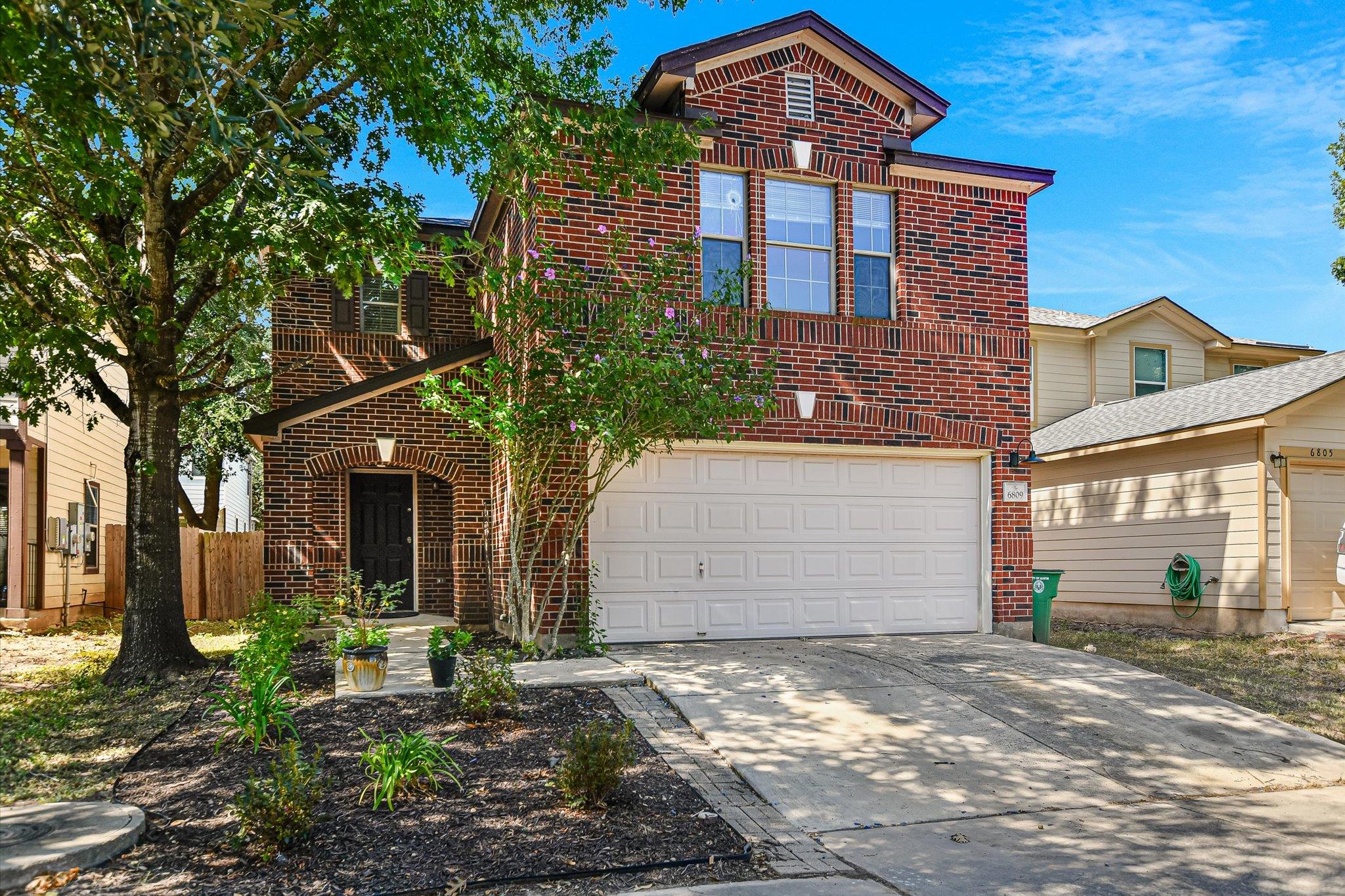Classic brick craftsmanship defines this two-stor