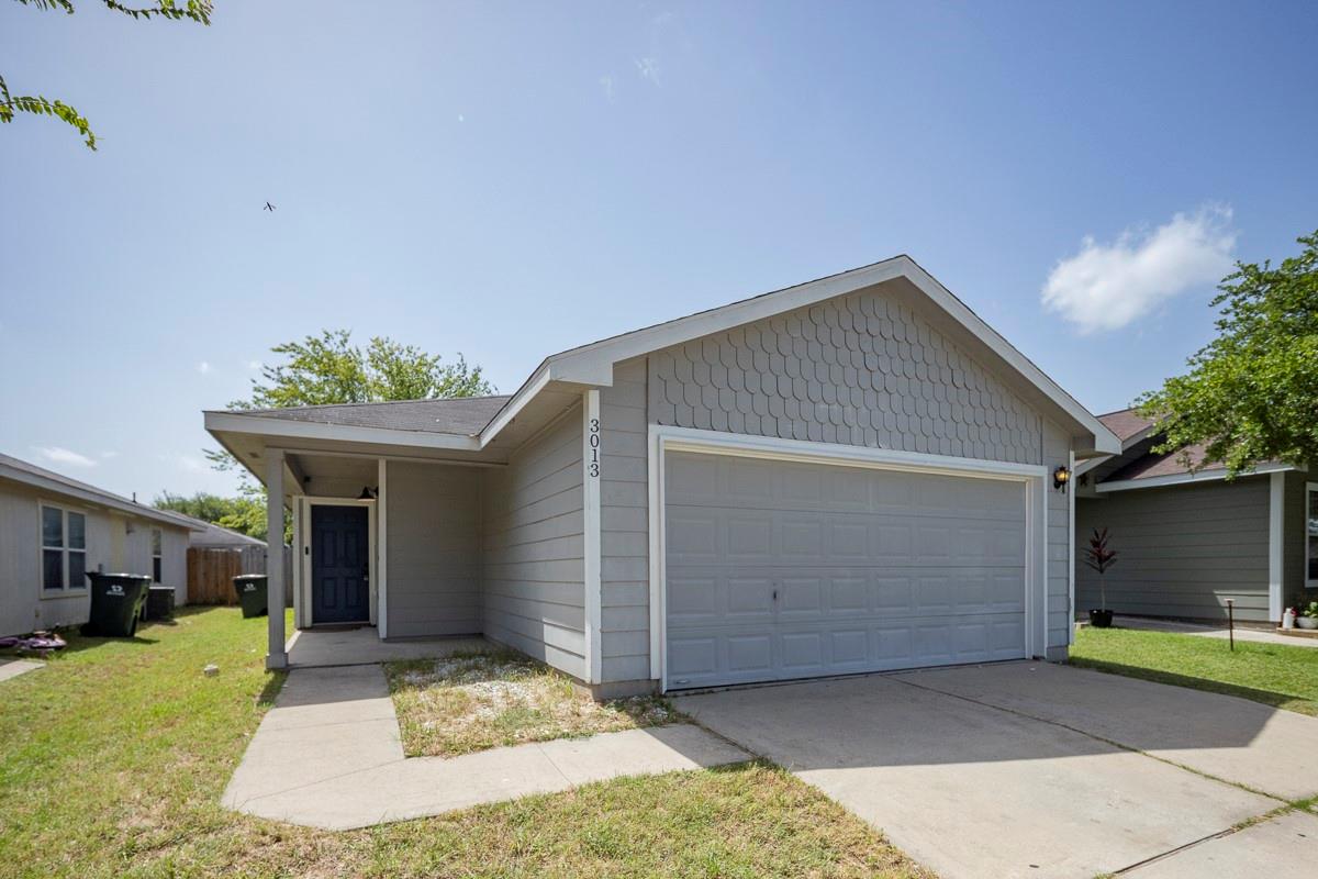 A welcoming facade features a covered entry and a