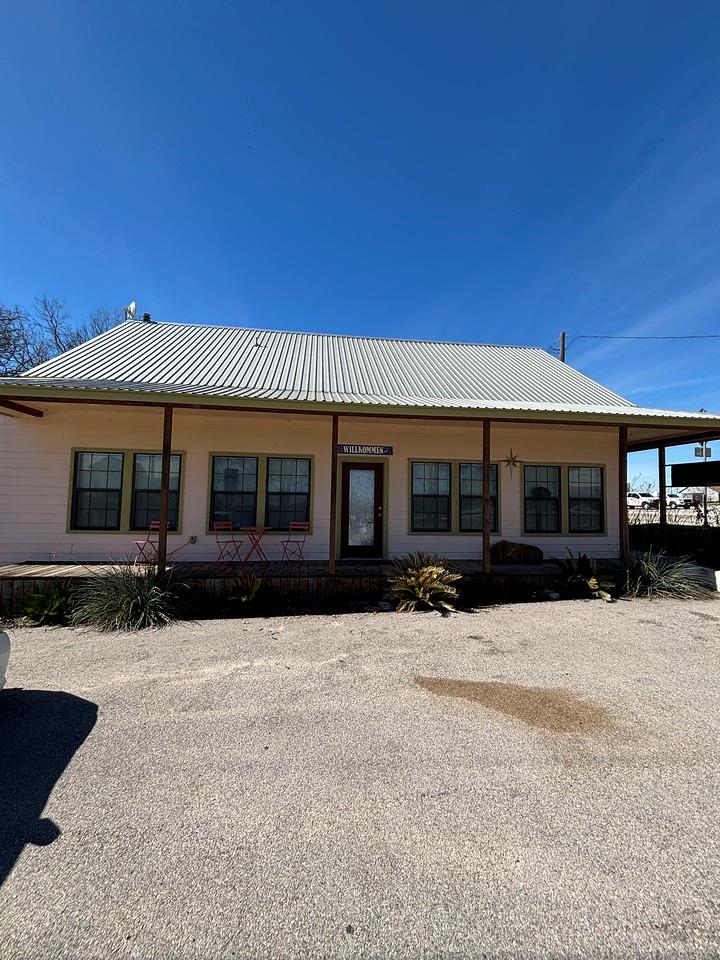 A welcoming front porch extends across this charm