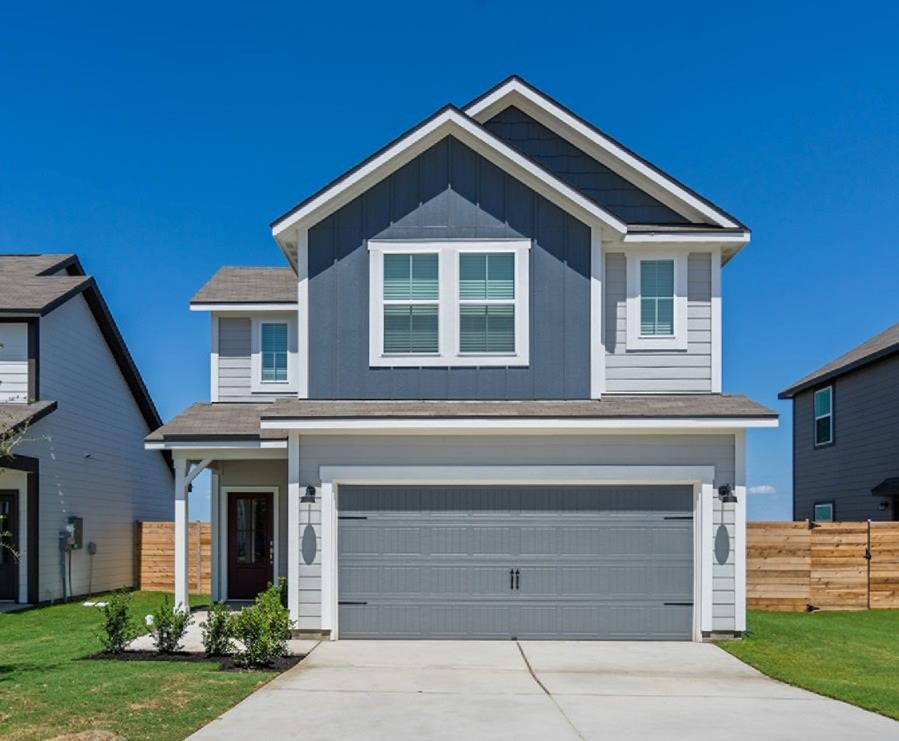 Two-story residence featuring a combination of ho