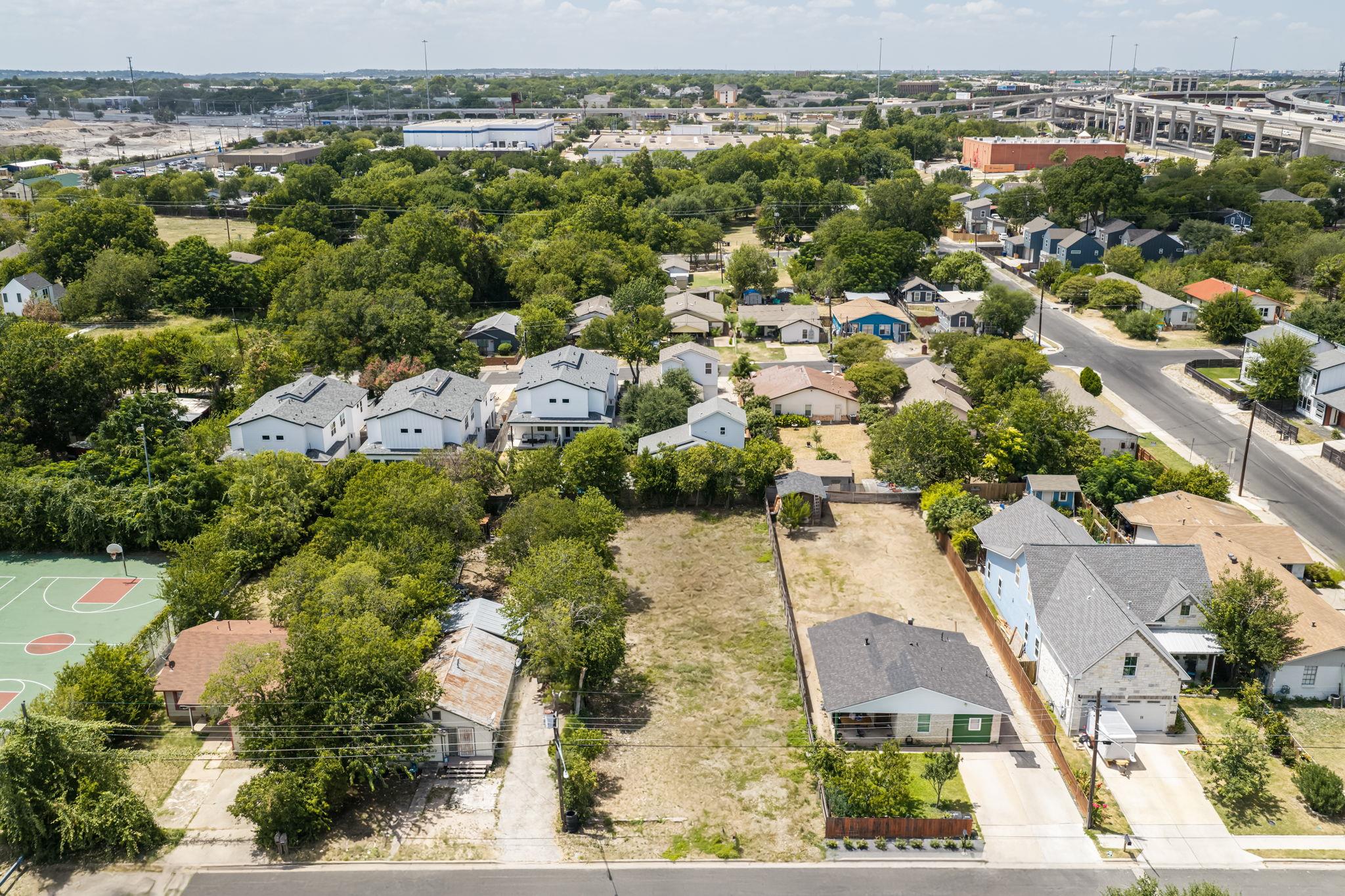 Lush mature trees surround this residential lot l