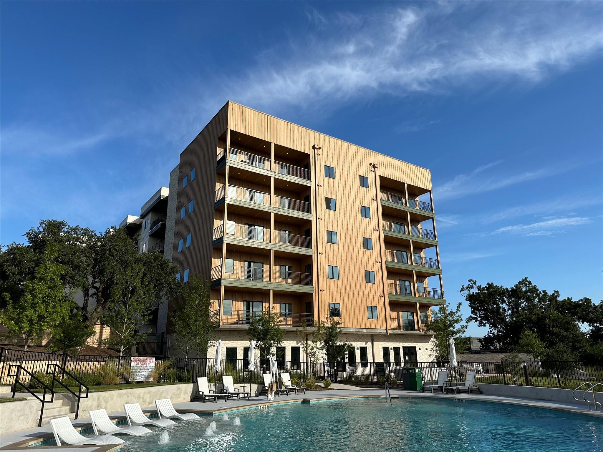 An inviting community pool beckons, perfectly com