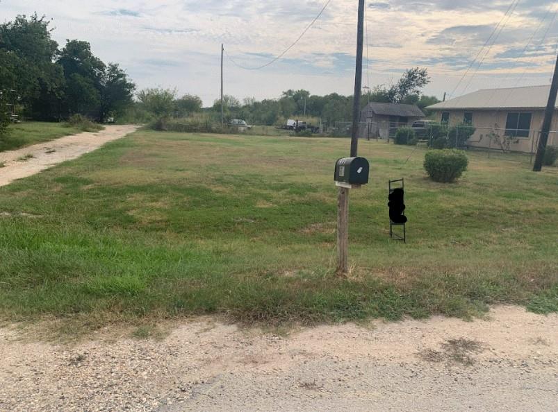 A spacious, verdant lot awaits your vision, offer