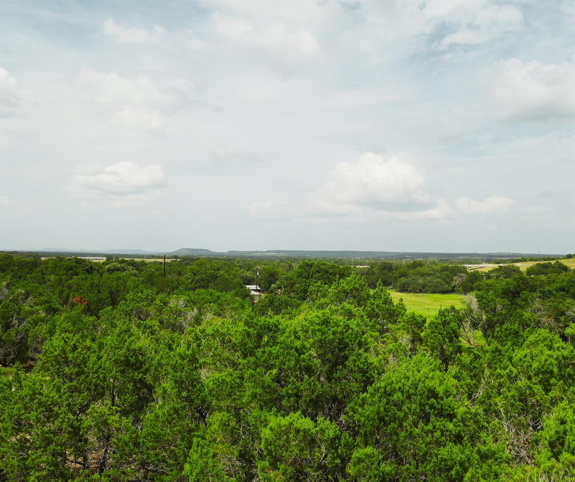 A verdant panorama unfolds, offering a secluded b