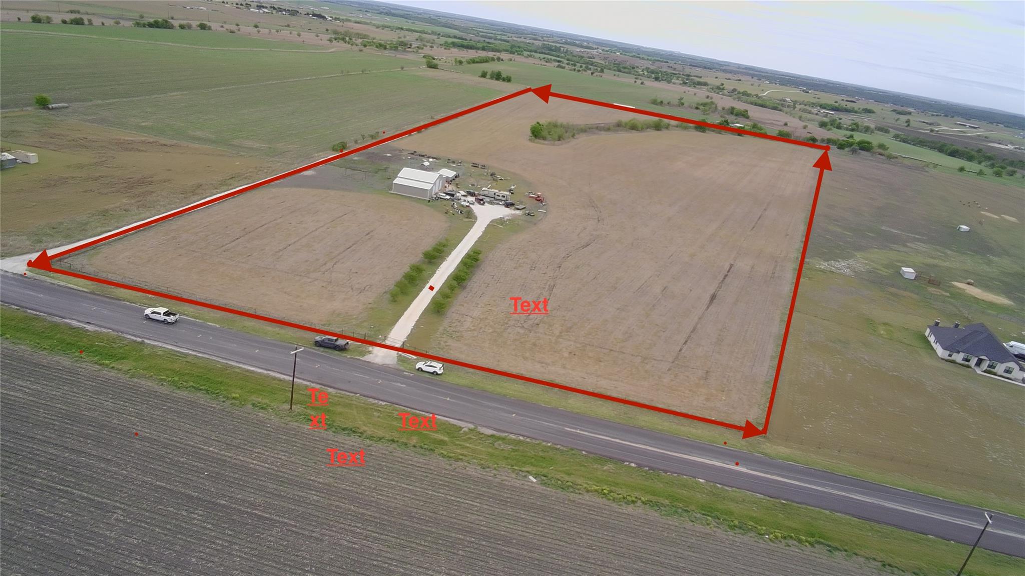 An aerial perspective showcases a rural property 