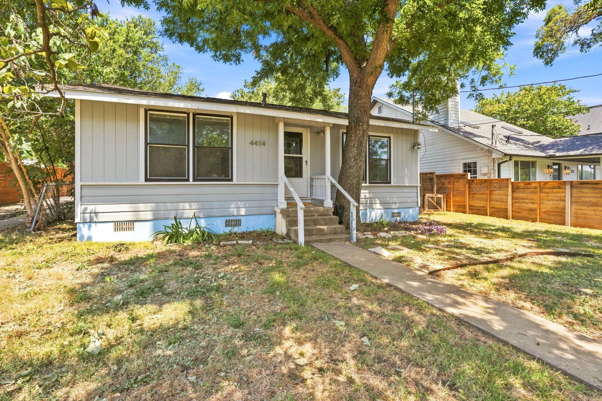 A charming cottage facade welcomes visitors with 