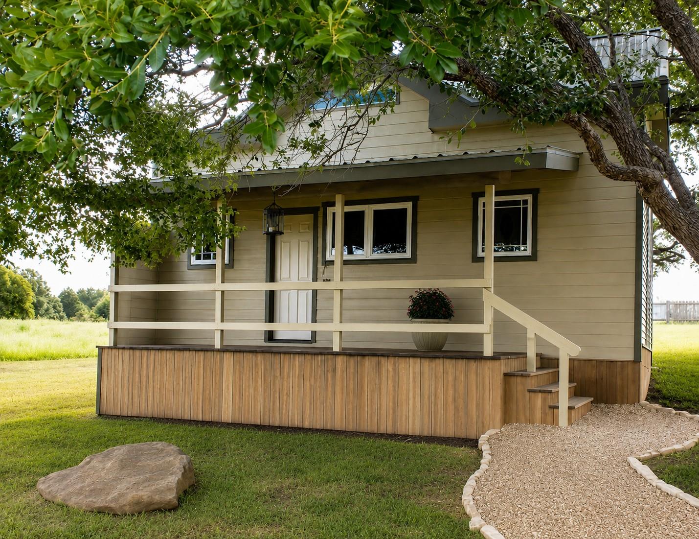 A charming cottage facade features a welcoming po