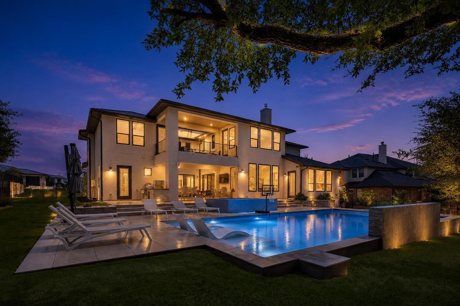 An inviting backyard oasis features a sparkling s