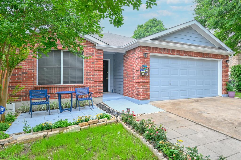 A welcoming brick facade with a neatly landscaped