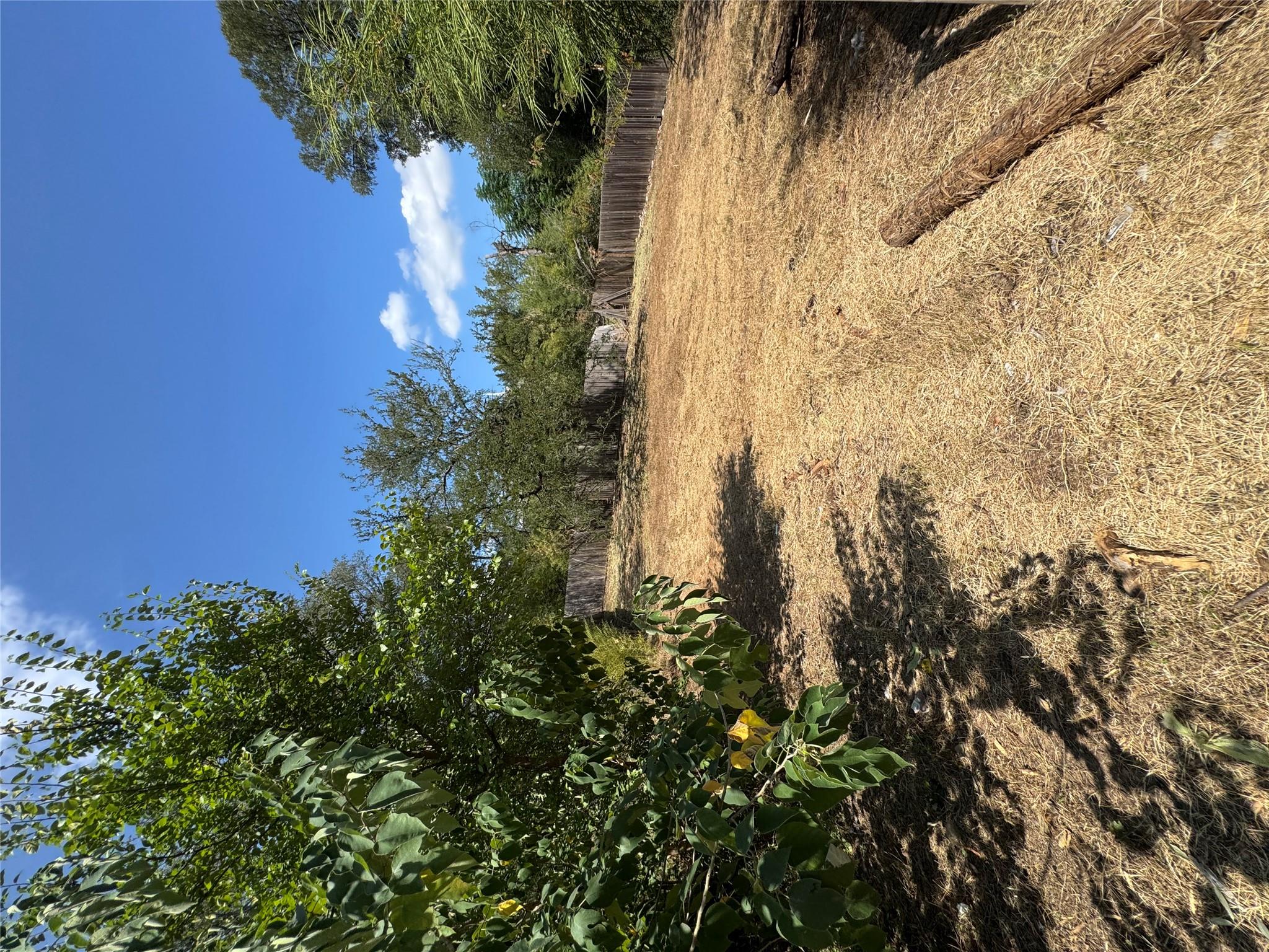 A spacious, fenced lot offers ample room for outd