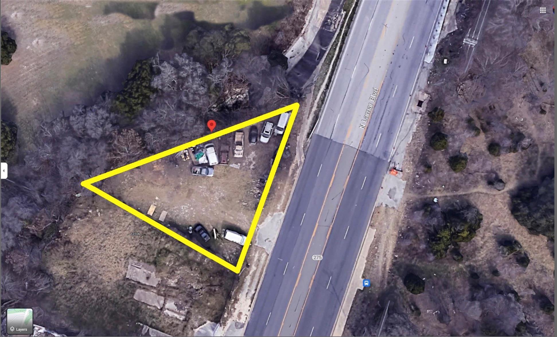 Aerial view showcasing a triangular lot bordering