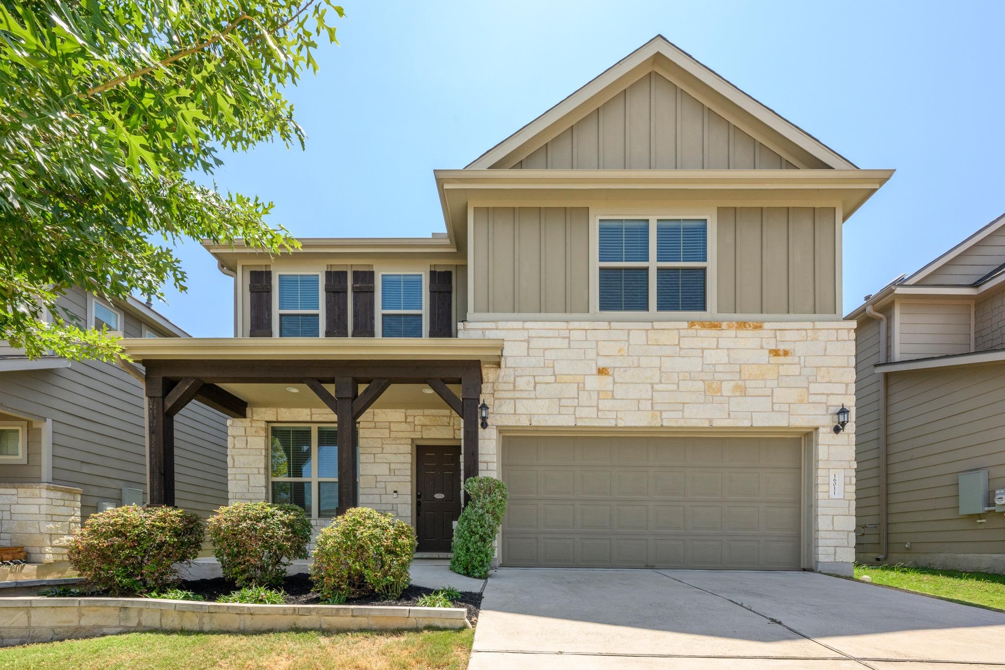A charming two-story residence with a welcoming c