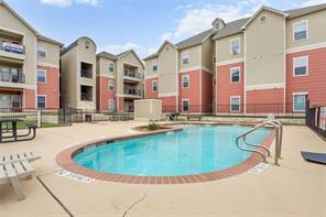 An inviting community pool anchors this multi-uni