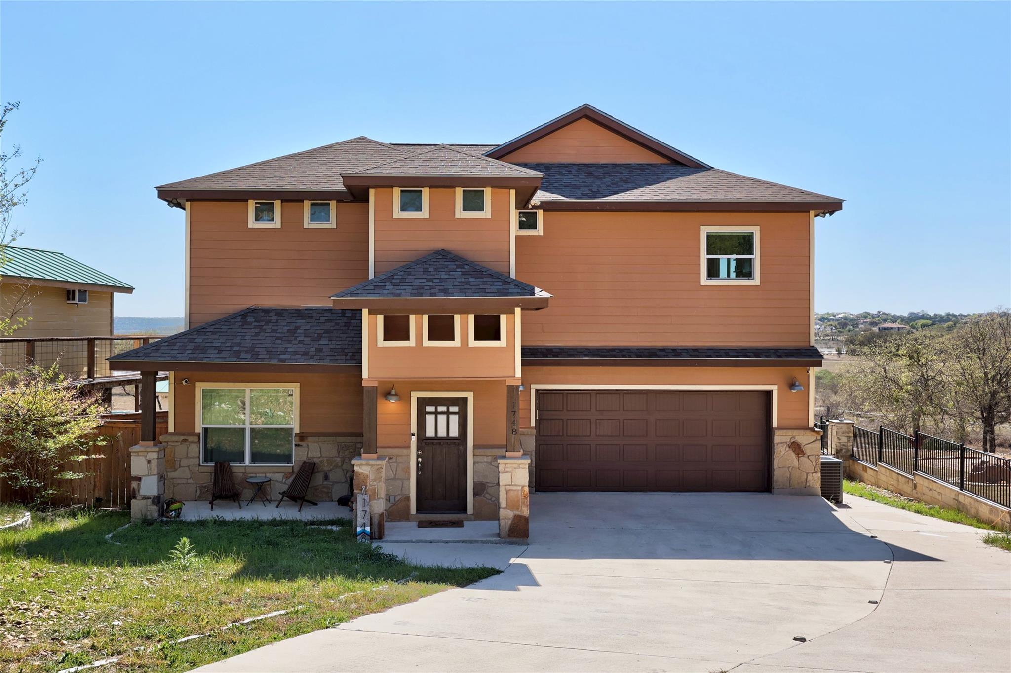 Crafted with stacked stone and rich cedar siding,