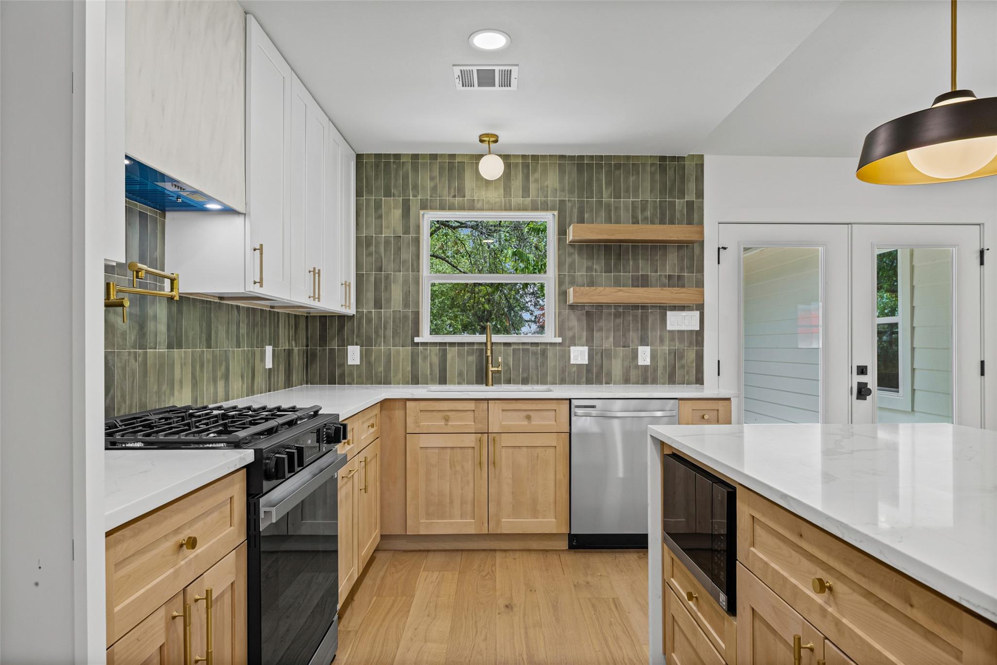 Gleaming stone countertops and warm wood cabinetr