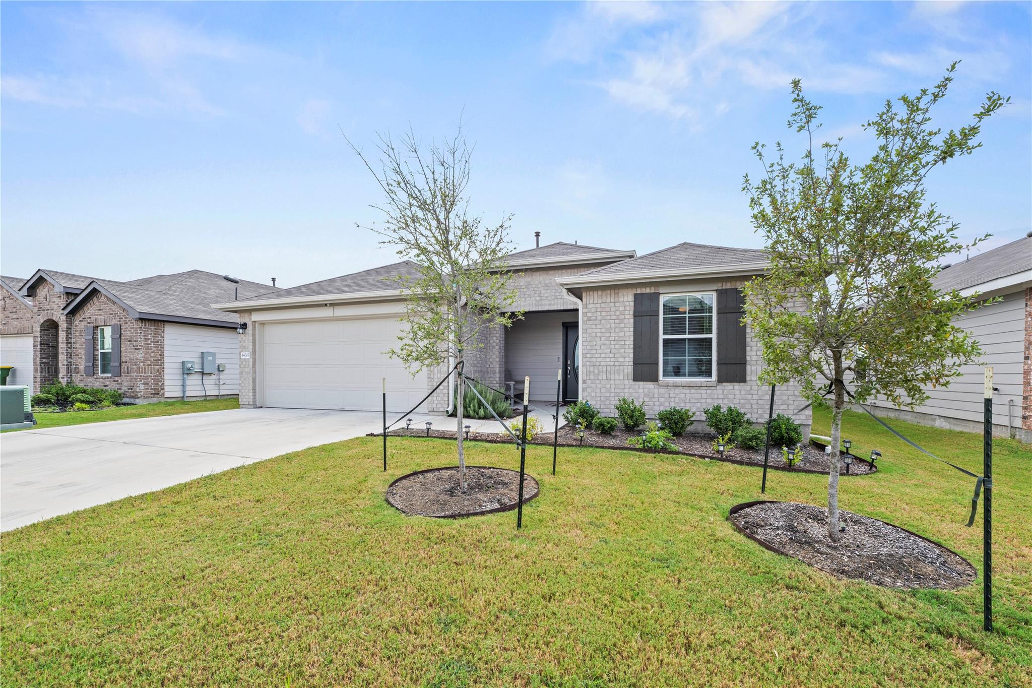 A well-maintained lawn and subtle landscaping enh