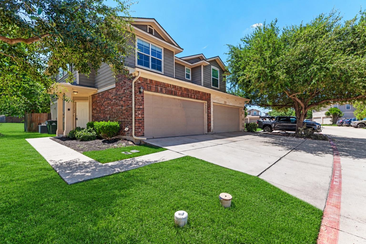 Well-maintained brick and siding exterior welcome