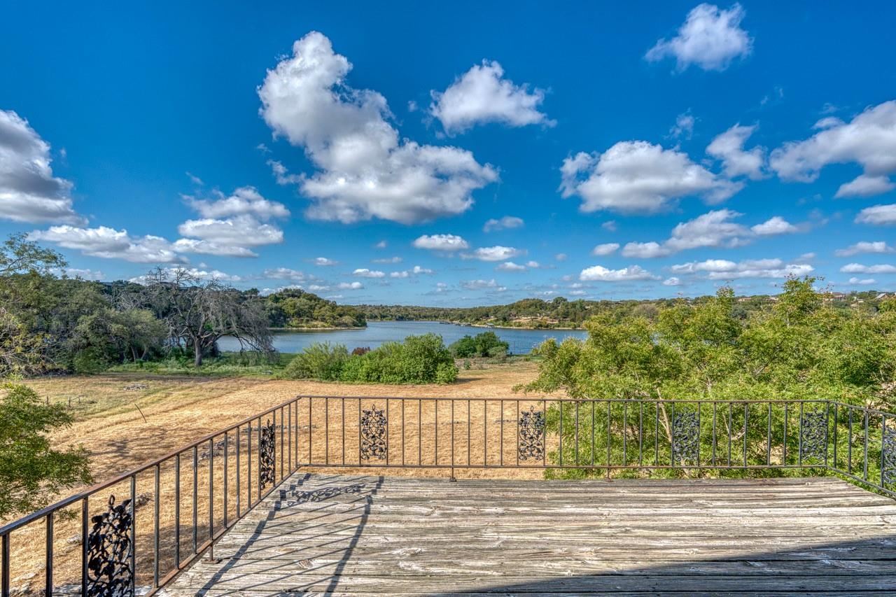 Panoramic water views stretch beyond the rustic w