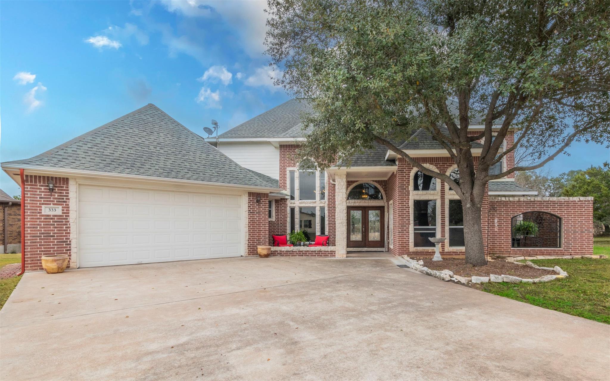 A grand brick facade with arched windows and a sp